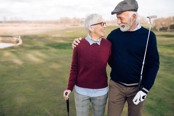 A senior couple enjoying a day of golfing