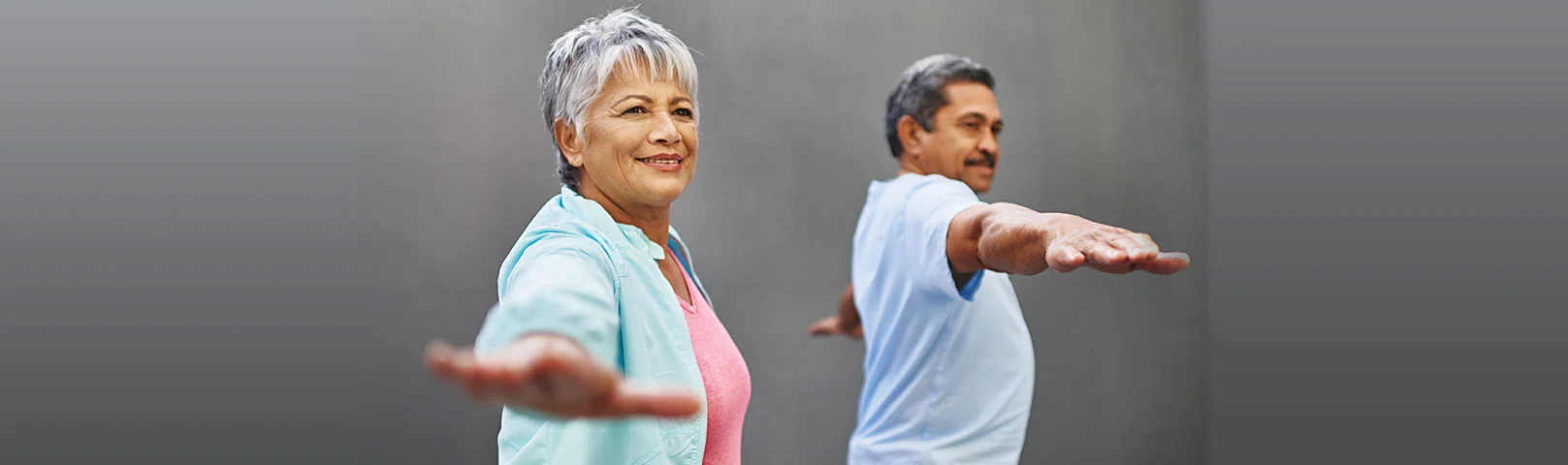 A mature woman extends her hand in order to balancer herself